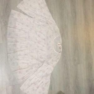 Butterfly pattern see through shirt.